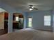 Spacious living room featuring neutral walls, carpet, and a ceiling fan at 5462 Union Hill Ct, Union City, GA 30291