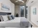 Comfortable bedroom featuring a concrete ceiling and a private balcony at 855 Peachtree Ne St # 1508, Atlanta, GA 30308