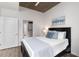 Cozy bedroom with minimalist decor, concrete ceilings, and ample natural light at 855 Peachtree Ne St # 1508, Atlanta, GA 30308