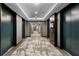 Hallway in building featuring carpeted floors and elevator access at 855 Peachtree Ne St # 1508, Atlanta, GA 30308