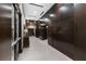 Building hallway featuring dark wood paneling and a neutral-colored tile floor at 855 Peachtree Ne St # 1508, Atlanta, GA 30308