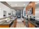 Contemporary kitchen with granite countertops and stainless steel appliances adjacent to an open living area at 855 Peachtree Ne St # 1508, Atlanta, GA 30308