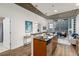 Modern kitchen with stainless steel appliances, granite countertops, and an island with a sink at 855 Peachtree Ne St # 1508, Atlanta, GA 30308