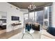 Living room with cityscape views, modern furniture, and wood-look flooring at 855 Peachtree Ne St # 1508, Atlanta, GA 30308