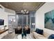 Living room with cityscape views, modern furniture, and wood-look flooring at 855 Peachtree Ne St # 1508, Atlanta, GA 30308