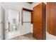 Walk-in closet with custom shelving and plenty of storage space, leading to bathroom at 855 Peachtree Ne St # 1508, Atlanta, GA 30308