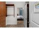 Walk-in closet showing bedroom and custom shelving with wood floors at 855 Peachtree Ne St # 1508, Atlanta, GA 30308