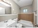 Clean bathroom with tub, toilet and updated vanity at 1454 Westridge Sw Rd, Atlanta, GA 30311