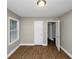 Bedroom with hardwood floors and access to another room at 1454 Westridge Sw Rd, Atlanta, GA 30311