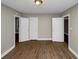 Spacious bedroom with hardwood floors and multiple entry points at 1454 Westridge Sw Rd, Atlanta, GA 30311