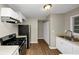 Modern kitchen featuring stainless steel appliances and white cabinets at 1454 Westridge Sw Rd, Atlanta, GA 30311