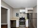 Stainless steel appliances and white cabinetry in this kitchen at 1454 Westridge Sw Rd, Atlanta, GA 30311