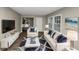 Living room with comfy sofas, hardwood floors, and a modern aesthetic at 1454 Westridge Sw Rd, Atlanta, GA 30311