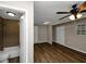 Spacious living room featuring wood flooring, ceiling fan and natural light at 1454 Westridge Sw Rd, Atlanta, GA 30311