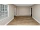 Simple living room with hardwood floors and large windows at 1454 Westridge Sw Rd, Atlanta, GA 30311