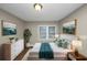 Main bedroom with wood floors, dresser and king bed at 1454 Westridge Sw Rd, Atlanta, GA 30311