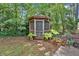 Backyard gazebo surrounded by lush landscaping and greenery at 2144 Kennesaw Due West Nw Rd, Kennesaw, GA 30152