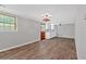 Basement kitchen area with wood-look flooring, cabinets, and a window at 2144 Kennesaw Due West Nw Rd, Kennesaw, GA 30152