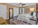 Bright bedroom with hardwood floors, a large window, and modern decor at 2144 Kennesaw Due West Nw Rd, Kennesaw, GA 30152