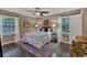 Bedroom with a ceiling fan, hardwood floors, and natural light at 2144 Kennesaw Due West Nw Rd, Kennesaw, GA 30152