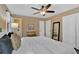 Bedroom with hardwood floors, modern decor, and a view into an adjoining bathroom at 2144 Kennesaw Due West Nw Rd, Kennesaw, GA 30152