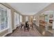 Dining room with hardwood floors, natural light, and an open archway leading to other living spaces at 2144 Kennesaw Due West Nw Rd, Kennesaw, GA 30152