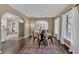 Dining room showcasing hardwood floors, large windows, and open archways leading to other living spaces at 2144 Kennesaw Due West Nw Rd, Kennesaw, GA 30152