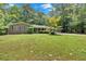 Charming brick home with well-manicured front yard and detached garage at 2144 Kennesaw Due West Nw Rd, Kennesaw, GA 30152