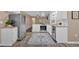 Bright kitchen with stainless steel appliances and white cabinets offers a fresh, modern feel at 2144 Kennesaw Due West Nw Rd, Kennesaw, GA 30152