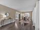 Bright living room showcasing hardwood floors, large windows, and open archways leading to other living spaces at 2144 Kennesaw Due West Nw Rd, Kennesaw, GA 30152