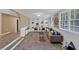 Cozy living room with custom built-ins, hardwood floors, and ample natural light from many large windows at 2144 Kennesaw Due West Nw Rd, Kennesaw, GA 30152