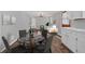 Bright open-concept living and dining area with hardwood floors and modern furnishings at 2144 Kennesaw Due West Nw Rd, Kennesaw, GA 30152