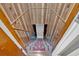 Cozy stairwell to basement with paneled walls and patterned carpet at 2144 Kennesaw Due West Nw Rd, Kennesaw, GA 30152