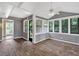 Bright sunroom features new floors, paneled walls and ample natural light at 2144 Kennesaw Due West Nw Rd, Kennesaw, GA 30152