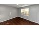 Bright bedroom with hardwood floors and large window at 2259 Nelms Sw Dr, Atlanta, GA 30315