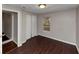 Bedroom with wood-look floors and access to hallway at 2259 Nelms Sw Dr, Atlanta, GA 30315