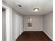 Simple bedroom with wood-look floors and closet at 2259 Nelms Sw Dr, Atlanta, GA 30315