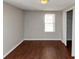 Simple bedroom with wood-look floors and a closet at 2259 Nelms Sw Dr, Atlanta, GA 30315
