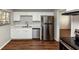 Kitchen with white cabinets, stainless steel appliances, and a quartz countertop at 2259 Nelms Sw Dr, Atlanta, GA 30315