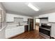 Modern kitchen featuring white cabinets and stainless steel appliances at 2259 Nelms Sw Dr, Atlanta, GA 30315