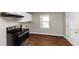 Eat-in kitchen with stainless steel appliances and white cabinets at 2259 Nelms Sw Dr, Atlanta, GA 30315