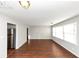Spacious living room with hardwood floors and access to the kitchen at 2259 Nelms Sw Dr, Atlanta, GA 30315