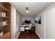 Home office with built-in shelves and hardwood floors at 2259 Nelms Sw Dr, Atlanta, GA 30315
