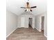 Bright bedroom featuring hardwood floors and a ceiling fan at 1162 Misty Meadows Xing, Hampton, GA 30228