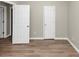 Empty bedroom with wood-look floors and neutral walls at 1162 Misty Meadows Xing, Hampton, GA 30228