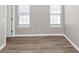 Spacious bedroom with wood-look floors and neutral walls at 1162 Misty Meadows Xing, Hampton, GA 30228