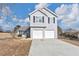 Two-story house with a gray exterior and a two-car garage at 1162 Misty Meadows Xing, Hampton, GA 30228
