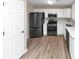 Modern kitchen with stainless steel appliances and white cabinets at 1162 Misty Meadows Xing, Hampton, GA 30228