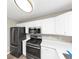 Modern kitchen with stainless steel appliances and white cabinets at 1162 Misty Meadows Xing, Hampton, GA 30228