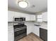 Updated kitchen featuring stainless steel appliances and white cabinetry at 1162 Misty Meadows Xing, Hampton, GA 30228